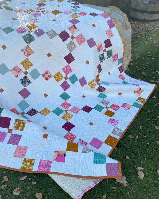 Harken Quilt draped over rock